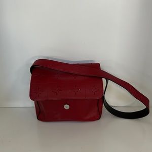 Kenneth Cole red hand bag. Length of strap shown in photos.